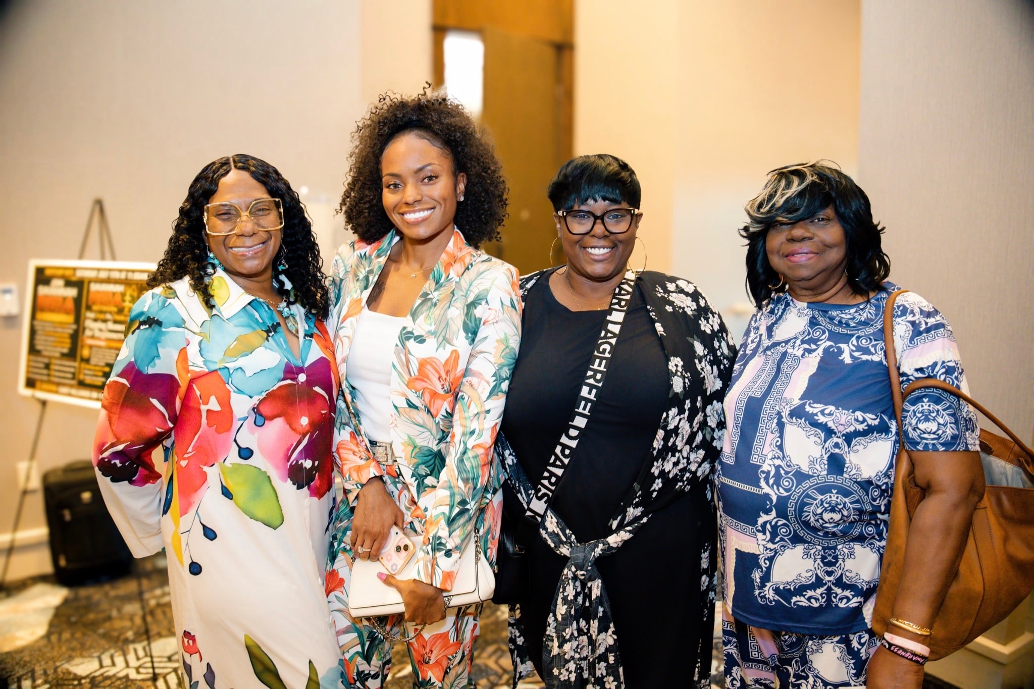 Brittney Harrison with attendees at a speaking event